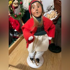 Byers choice set of 3. Two child skaters and one adult female. All in red.